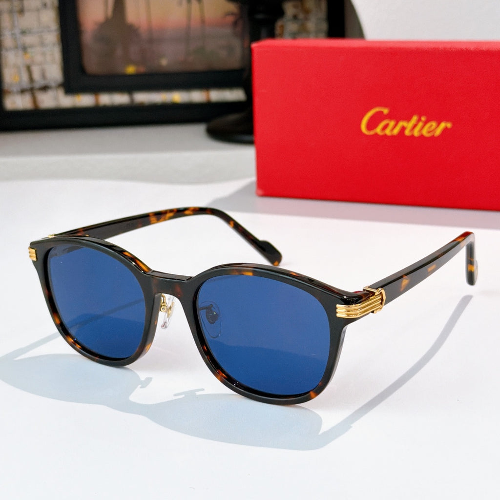 Cartier sunglasses with blue lenses and tortoiseshell frames