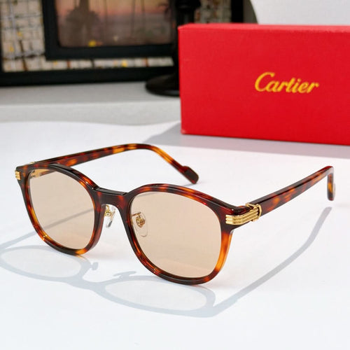 Cartier sunglasses with amber tortoiseshell frames and light lenses