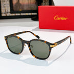 Cartier sunglasses with dark lenses and tortoiseshell frames