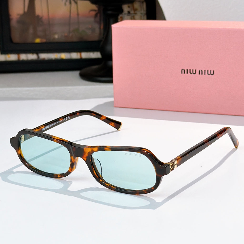 Sunglasses with tortoiseshell frame and light blue tinted lenses, rounded cat-eye shape