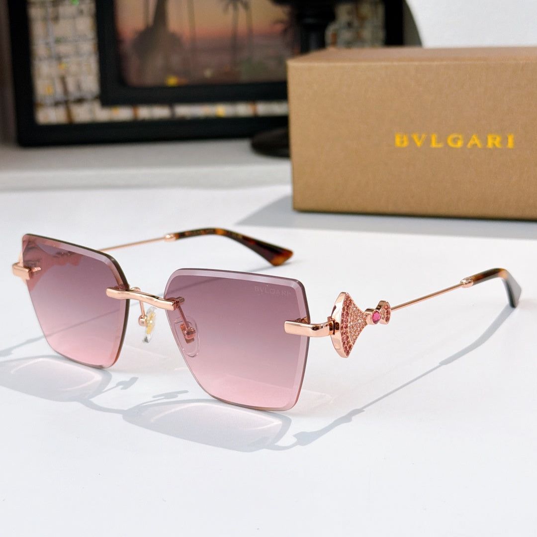 Bvlgari sunglasses with pink lenses, gold frame, jeweled bridge detail.