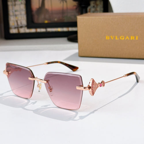 Bvlgari sunglasses with pink lenses, gold frame, jeweled bridge detail.