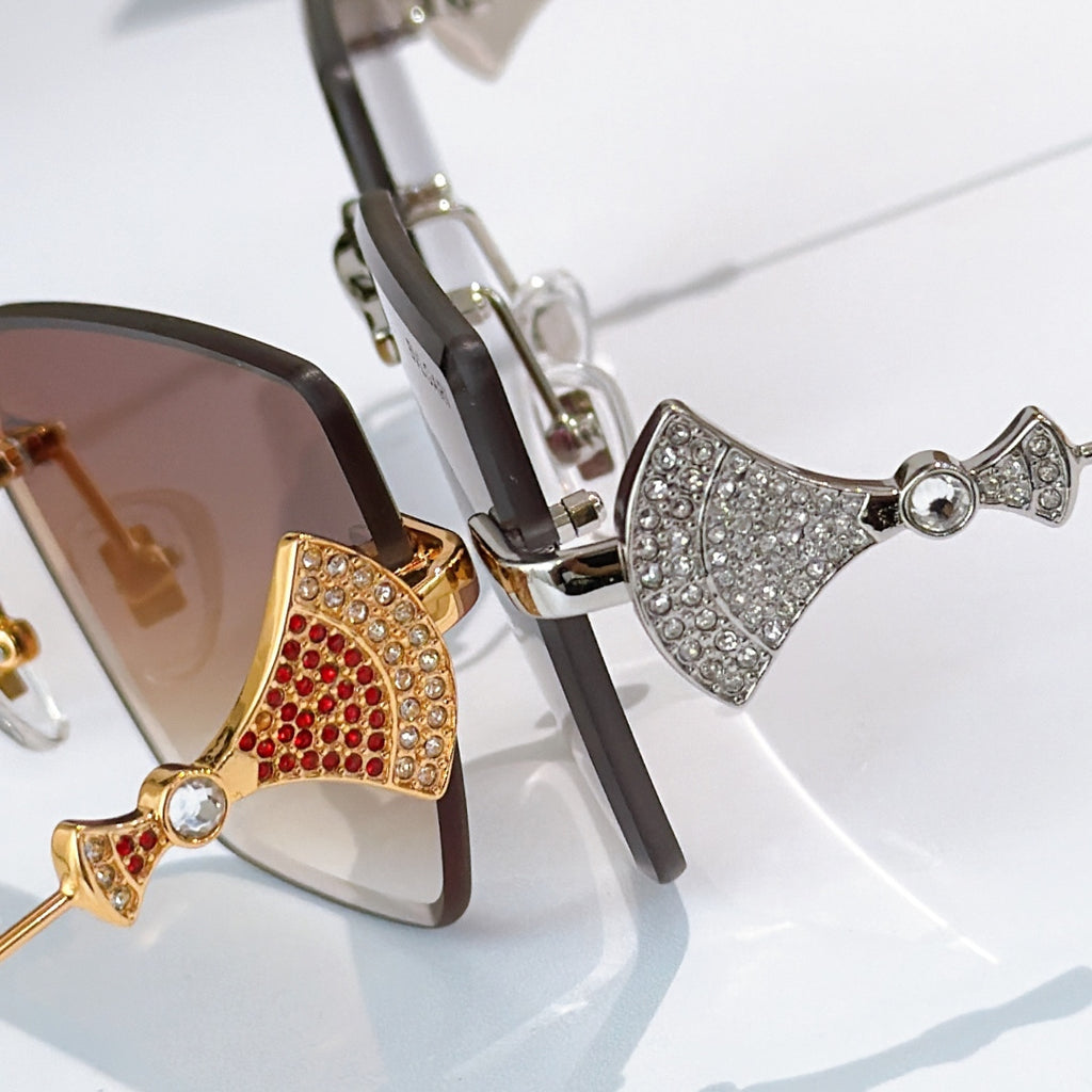 Bvlgari sunglasses close-up with jeweled bridge and metal temples, mixed metal frames.