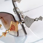 Bvlgari sunglasses close-up with jeweled bridge and metal temples, mixed metal frames.