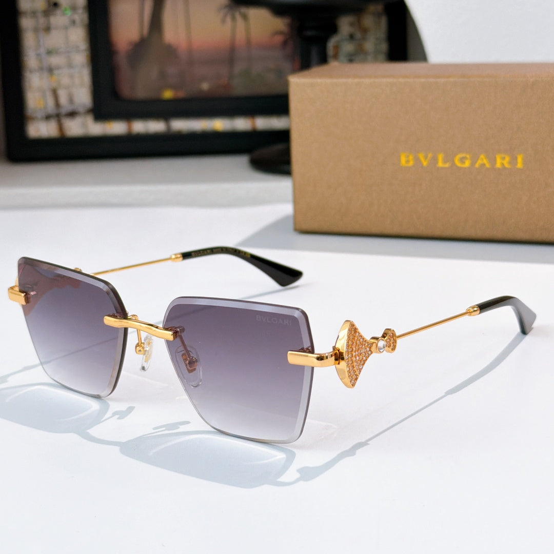 Bvlgari sunglasses with purple lenses, gold frame, jeweled bridge detail.
