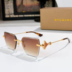 Bvlgari sunglasses with amber lenses, gold frame, jeweled bridge detail.