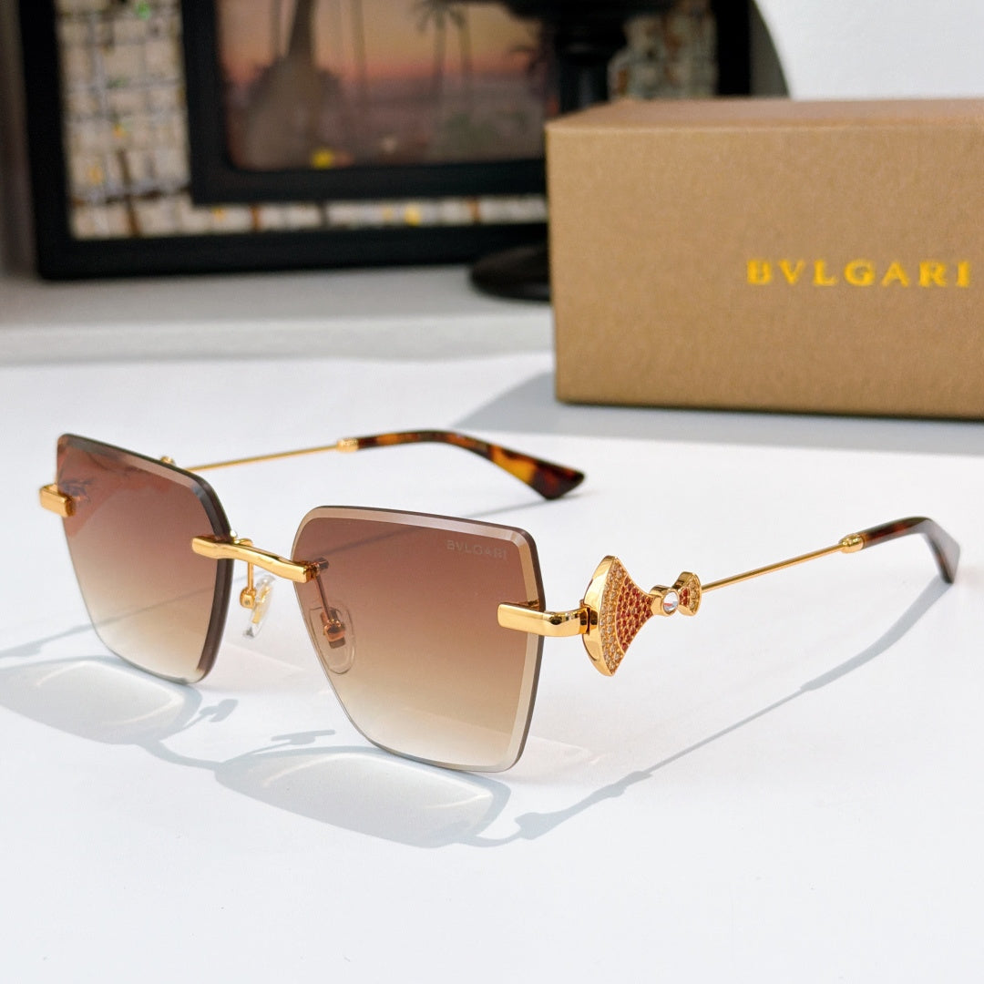 Bvlgari sunglasses with amber lenses, gold frame, jeweled bridge detail.