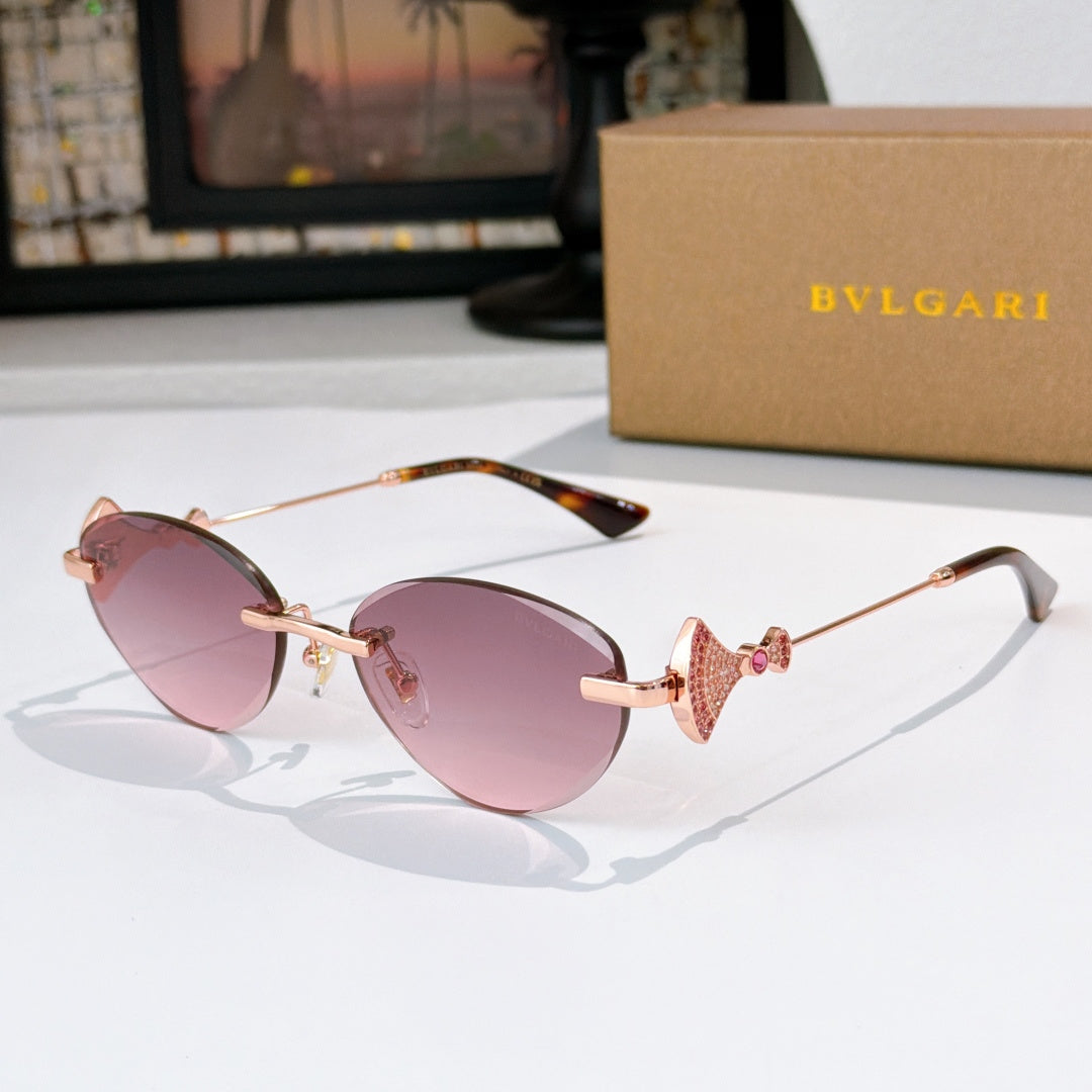 Bvlgari sunglasses with gold-tone frame, rose lenses, and tortoiseshell arms.
