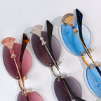 Embellished Bvlgari sunglasses assortment with blue, pink, and purple lenses.