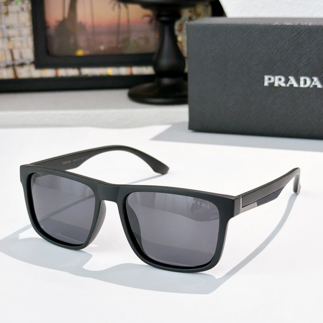 Sunglasses with dark frames and tinted lenses, textured temple detail