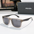 Sunglasses with light beige frames and tinted lenses