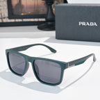 Sunglasses with dark green frames and tinted lenses