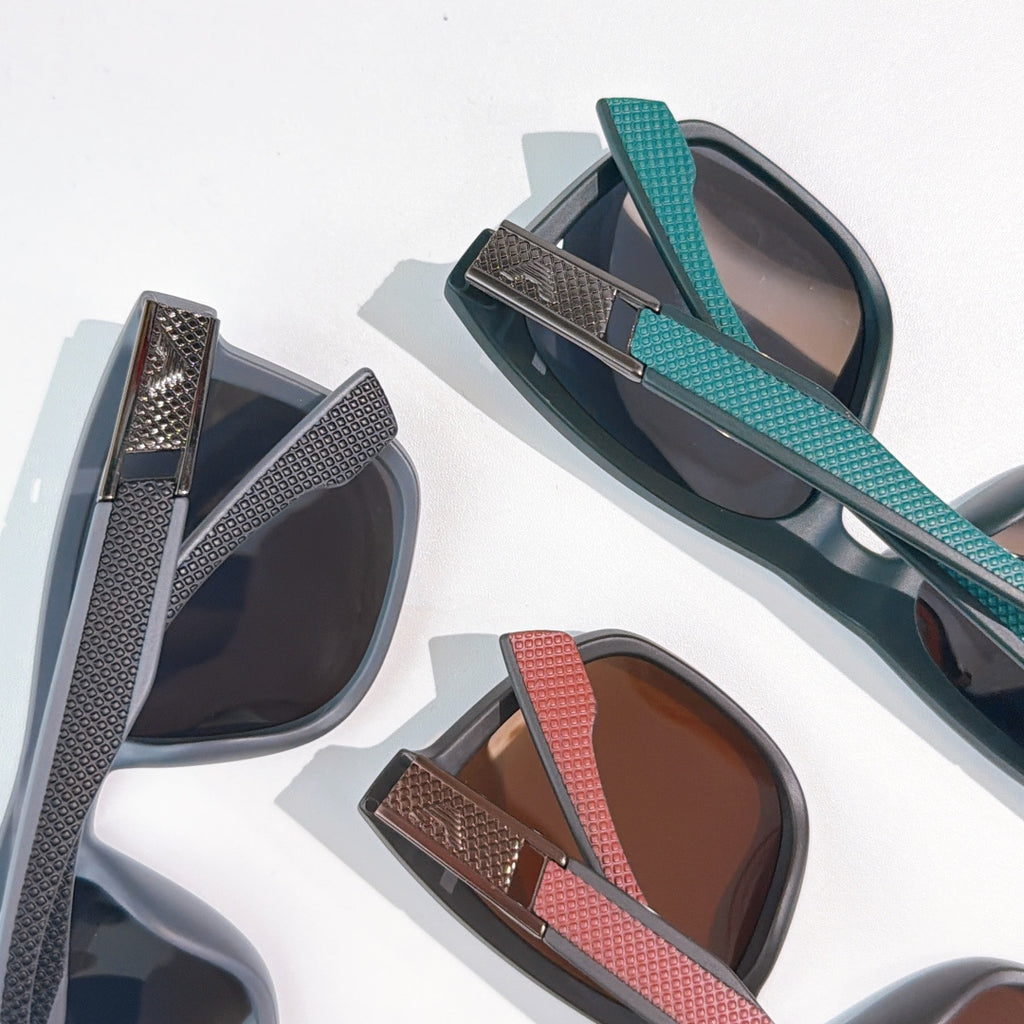 Prada sunglasses with teal and red temples and tinted lenses