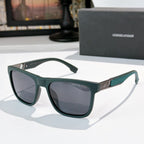 Prada rectangular sunglasses with dark gray lenses and teal frame