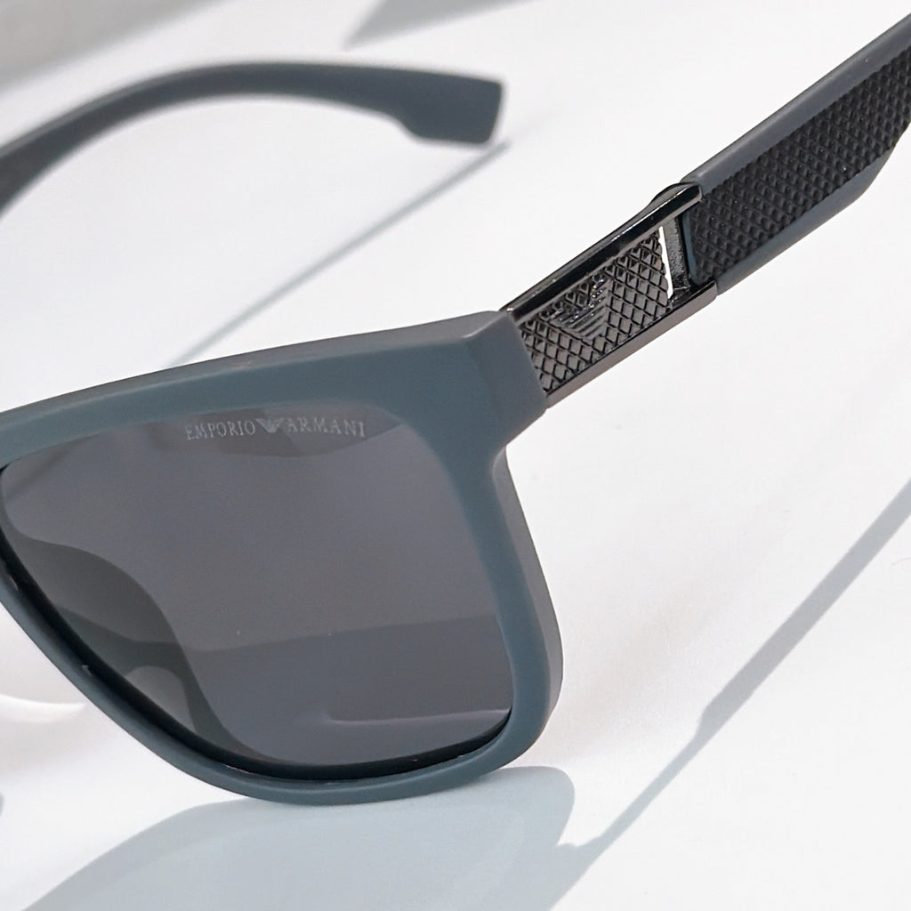 Prada sunglasses close-up of textured temple and dark gray lens