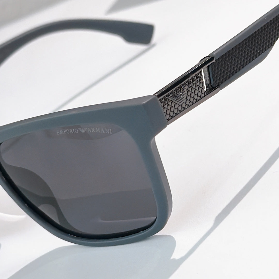 Prada sunglasses close-up of textured temple and dark gray lens