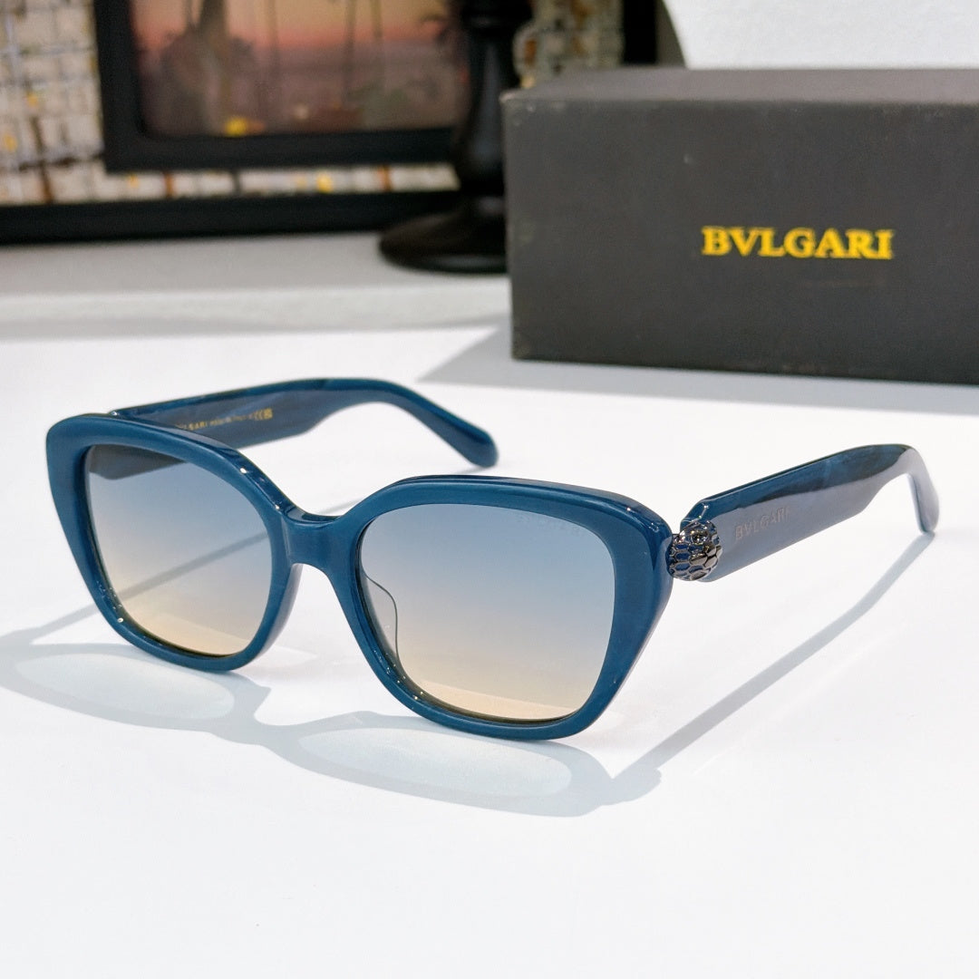 Blue square eyeglasses with light-tinted lenses and gold logo detail