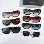 Assorted eyeglasses with mixed frames: tortoise, black, red, blue, green, and white