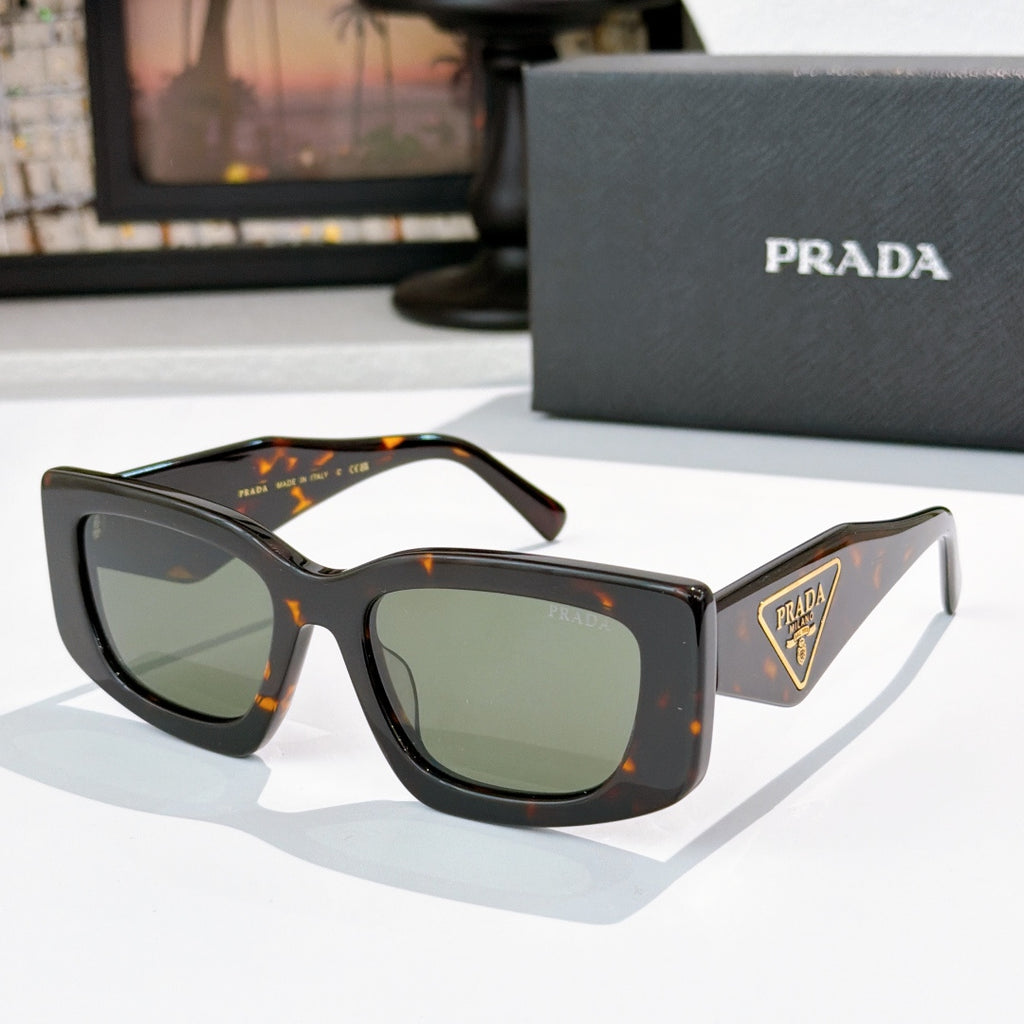 PRADA dark tortoiseshell cat-eye sunglasses with logo badge and tinted lenses