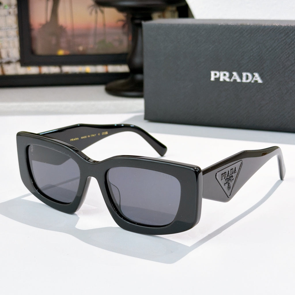 PRADA black cat-eye sunglasses with logo badge and dark tinted lenses