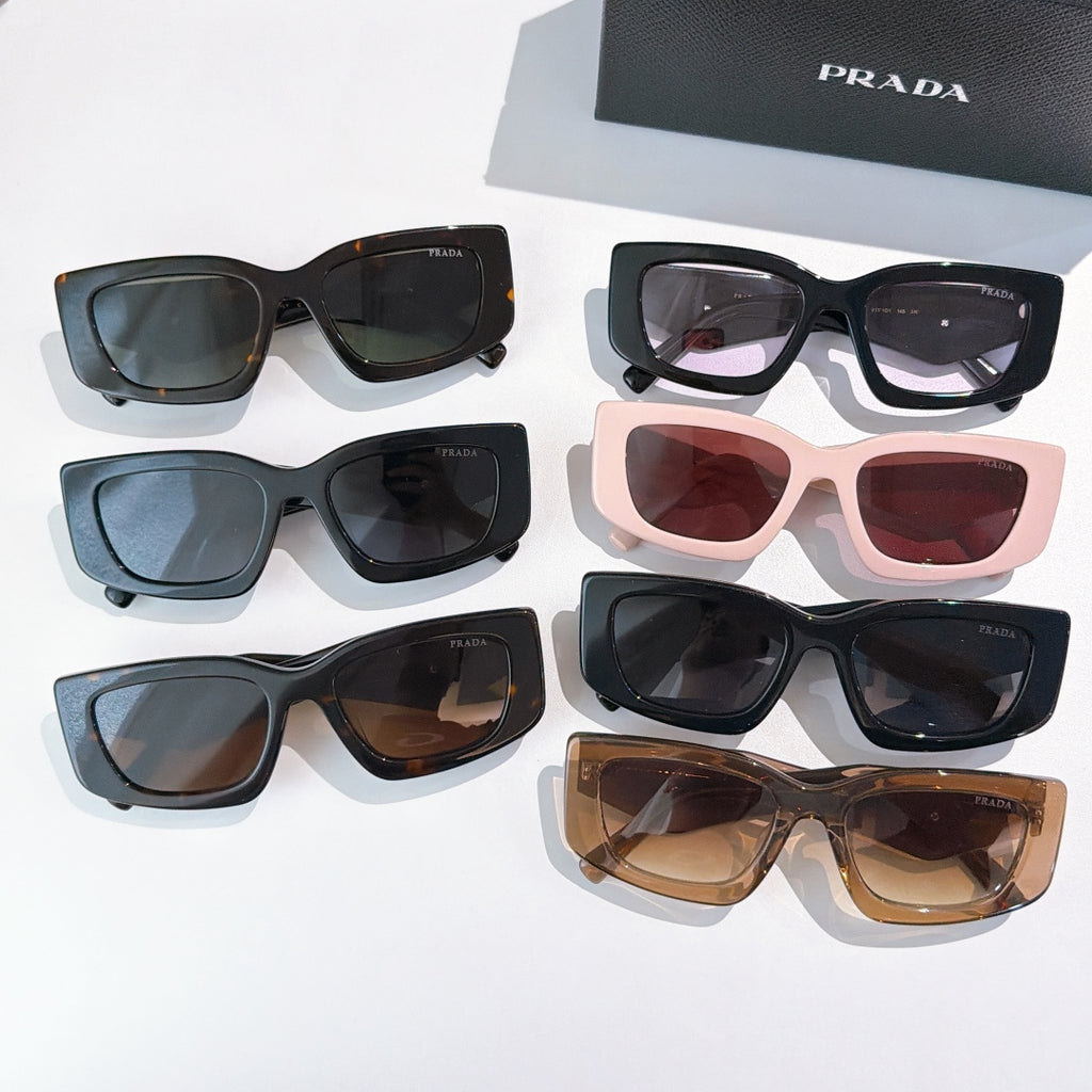 Assorted PRADA sunglasses with mixed frames and tinted lenses, shown together