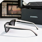 CHANEL cat-eye sunglasses, black frames with pink-tinted lenses, white temples