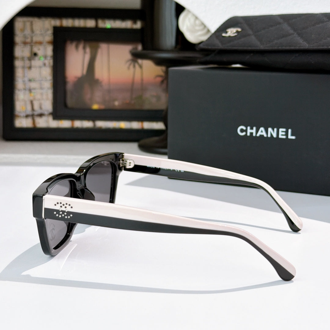 CHANEL cat-eye sunglasses, black frames with pink-tinted lenses, white temples