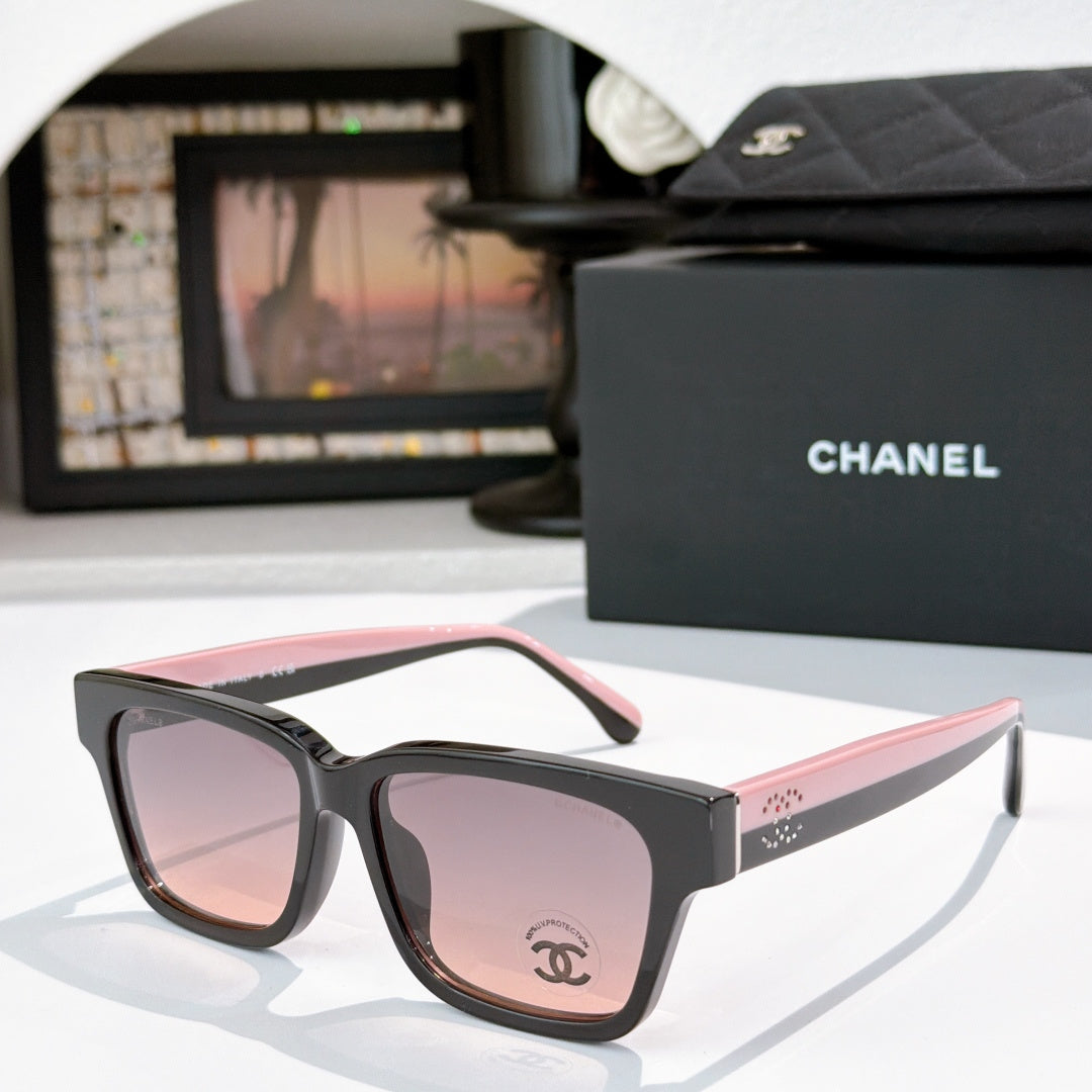 CHANEL cat-eye sunglasses: black frames, pink-tinted lenses, pale pink temples