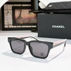 CHANEL cat-eye sunglasses, black frames with gray-tinted lenses, pale pink temples