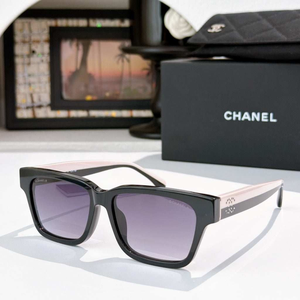 CHANEL cat-eye sunglasses, black frames with purple-tinted lenses, white temples