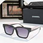 CHANEL cat-eye sunglasses, black frames with purple-tinted lenses, white temples