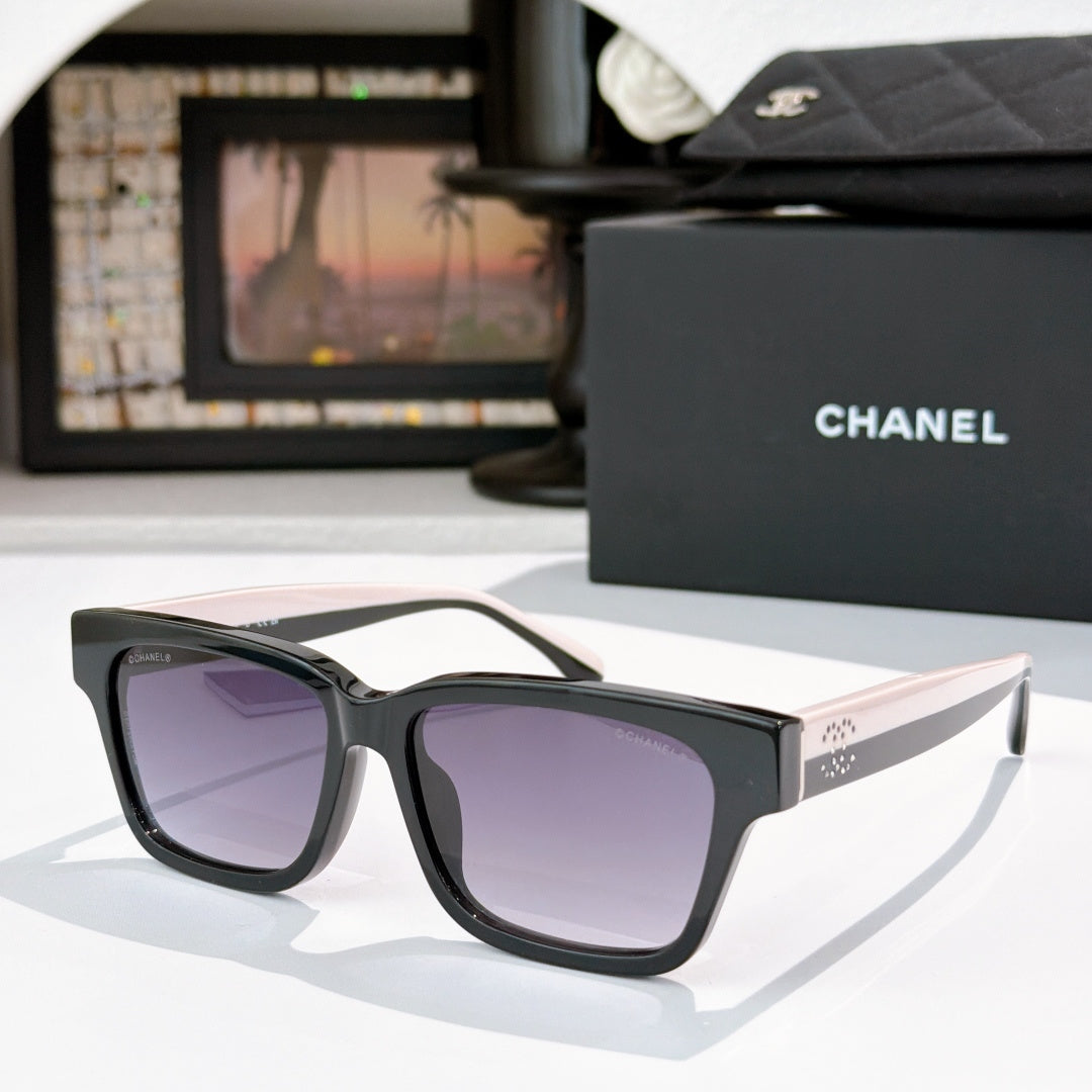 CHANEL cat-eye sunglasses, black frames with purple-tinted lenses, white temples