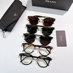 Prada glasses set, stacked frames with black case and lens pouches
