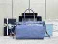 Light blue leather Prada handbag with two top handles and gold hardware