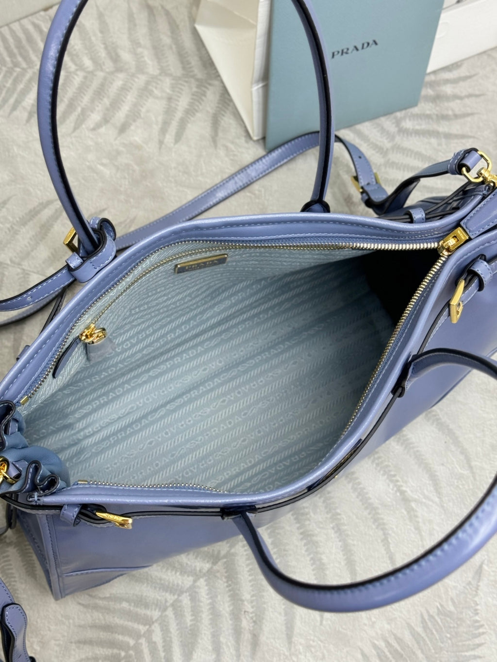 Light blue Prada handbag interior with zipper pocket and textured lining