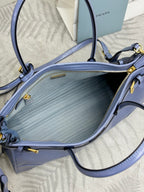 Light blue Prada handbag interior with zipper pocket and textured lining