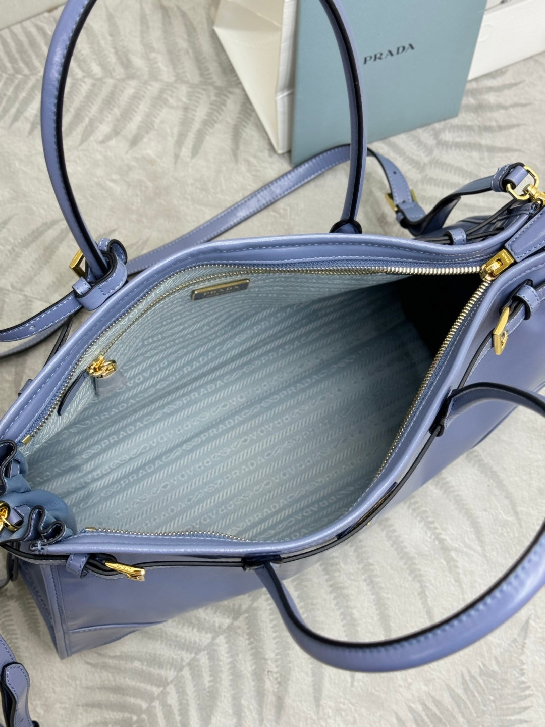 Light blue Prada handbag interior with zipper pocket and textured lining