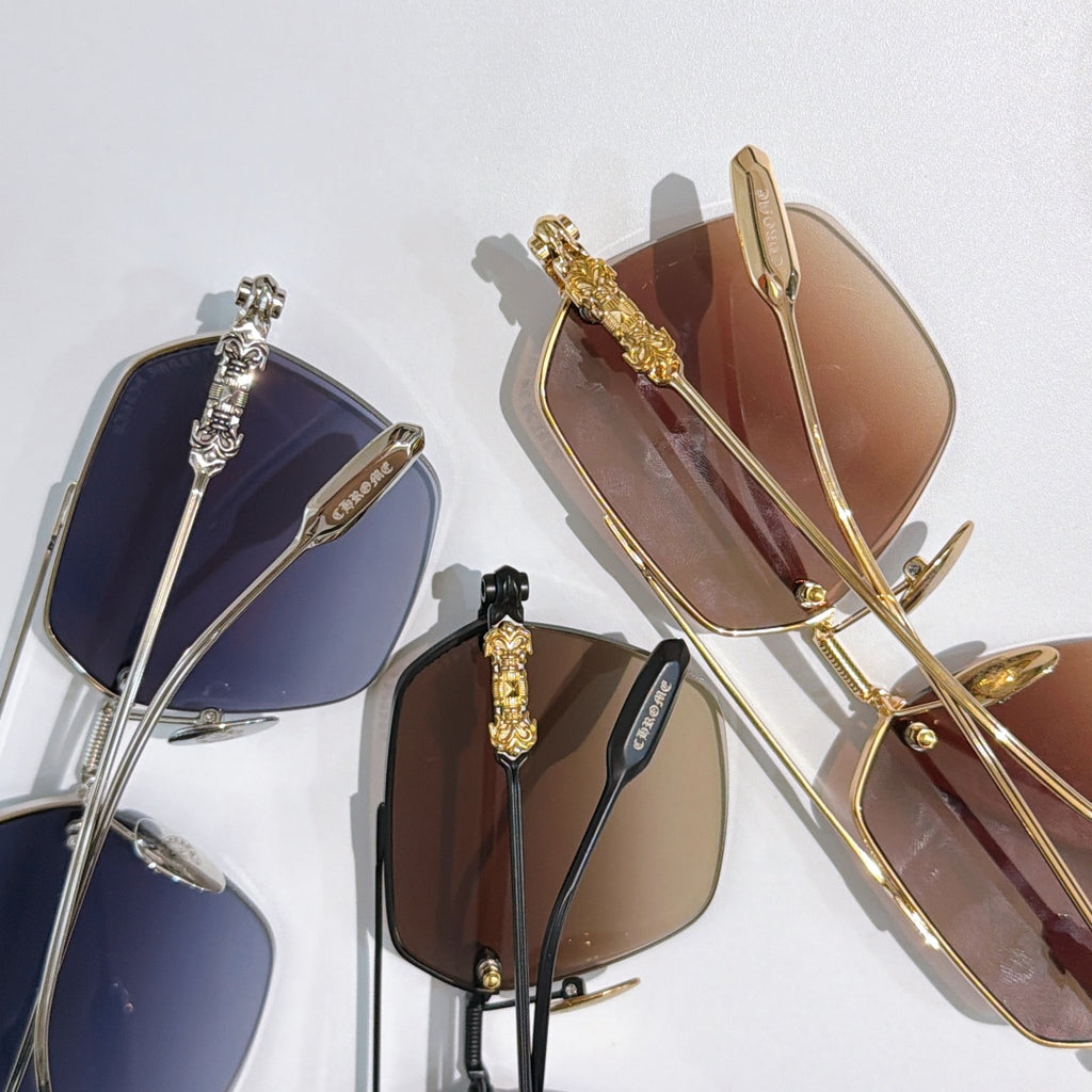 Chrome metal sunglasses with assorted tinted lenses, multiple pairs shown