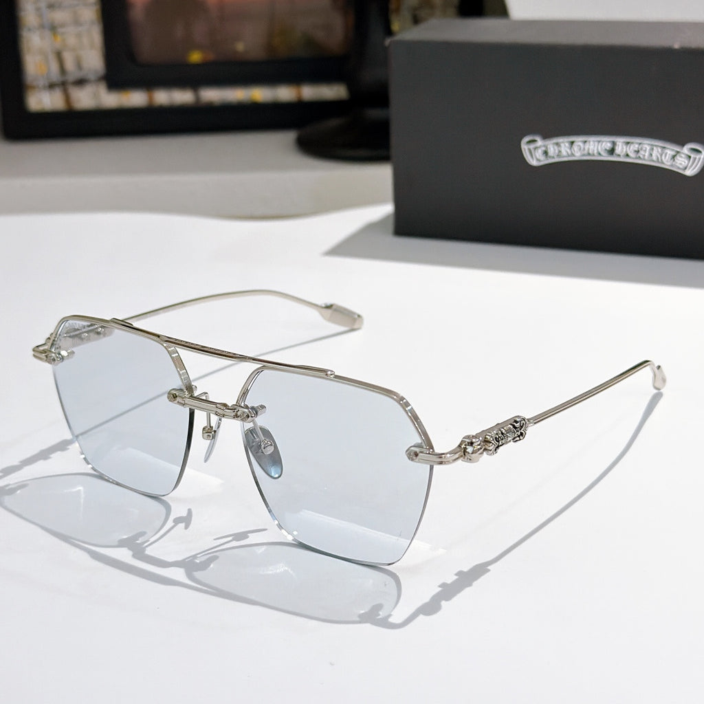 Chrome metal sunglasses with clear lenses and silver arms, side hardware visible