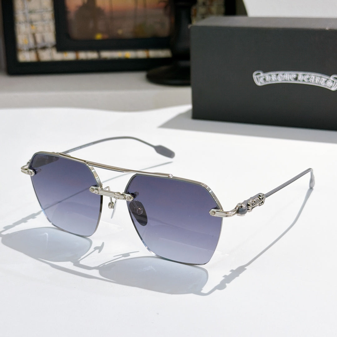 Chrome metal sunglasses with blue tinted lenses and ornate silver temple details