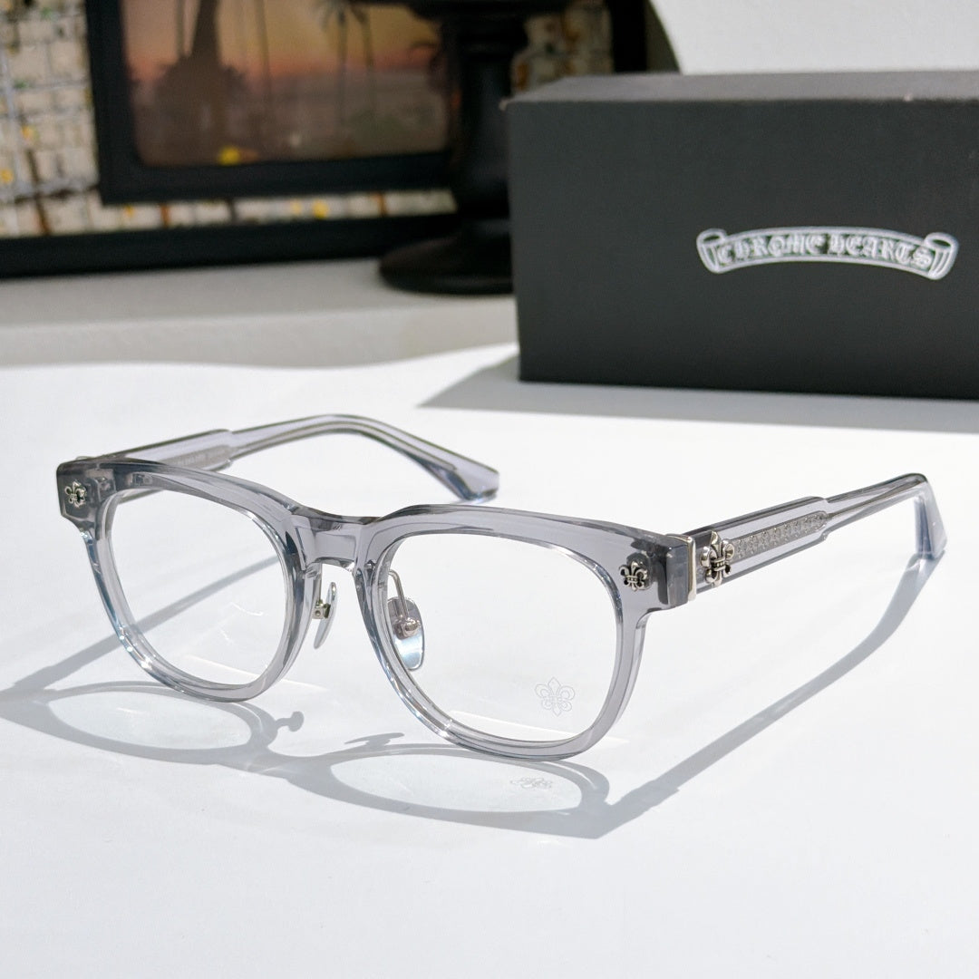 Light gray eyeglass frames with silver ornate hinges and clear lenses