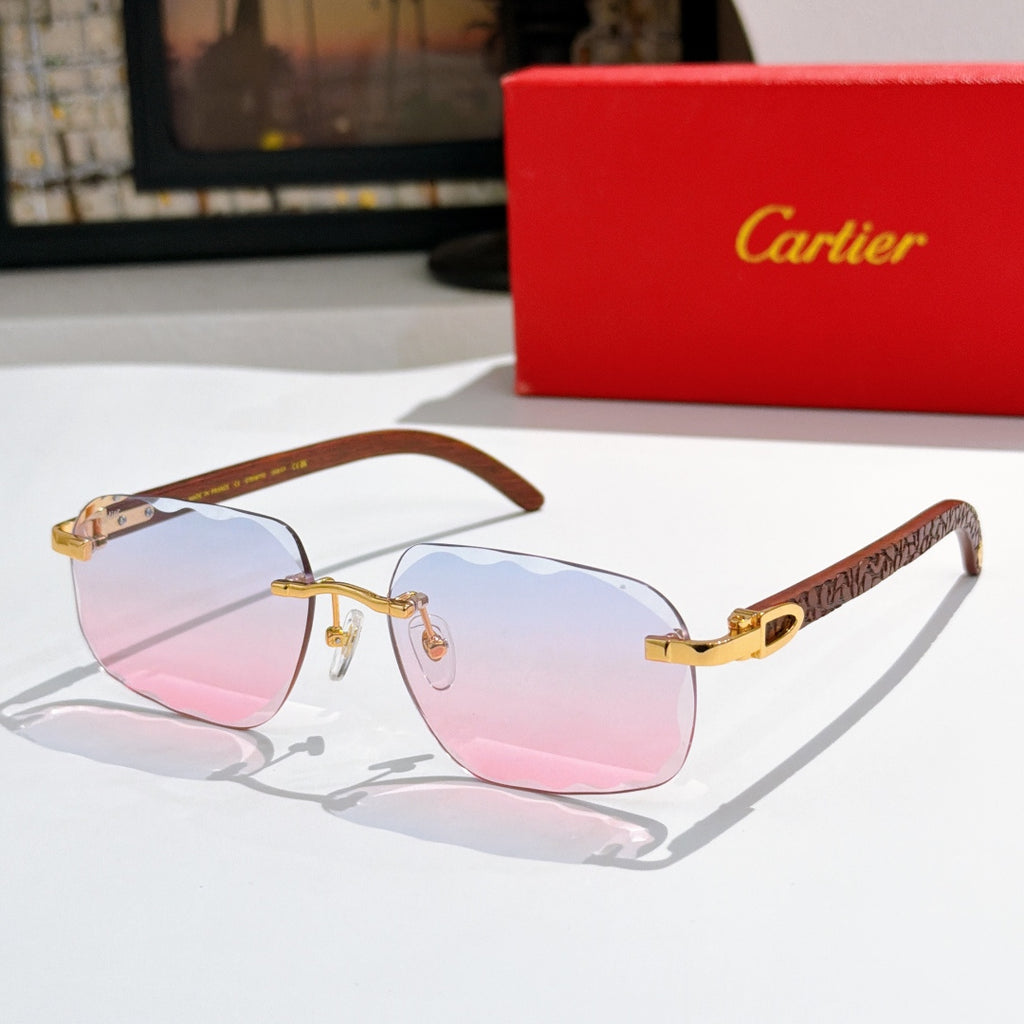 Gold-tone sunglasses with pink mirrored gradient lenses and patterned temple arms