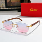 Gold-tone sunglasses with pink mirrored gradient lenses and patterned temple arms