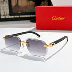 Sunglasses with dark tinted lenses, gold bridge, and black patterned temple arms
