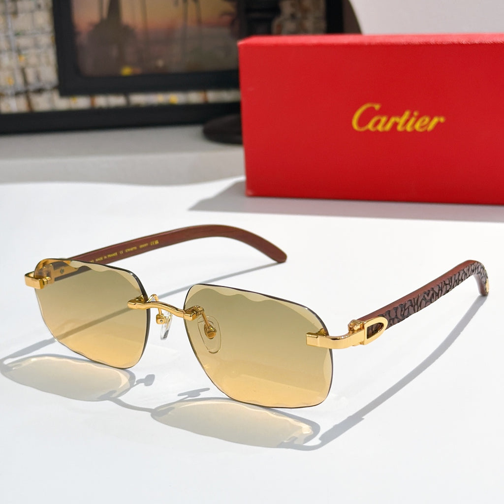Gold-tone aviator sunglasses with amber gradient lenses and patterned temple arms