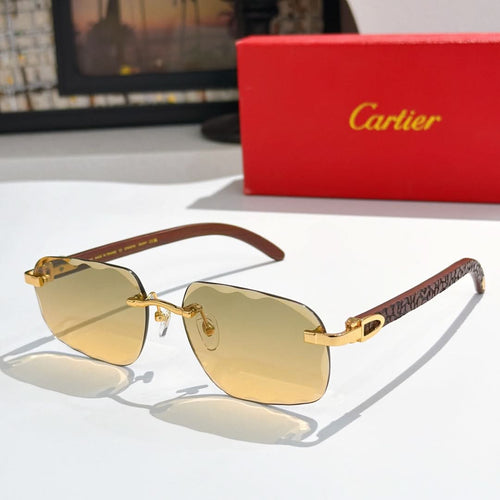 Gold-tone aviator sunglasses with amber gradient lenses and patterned temple arms