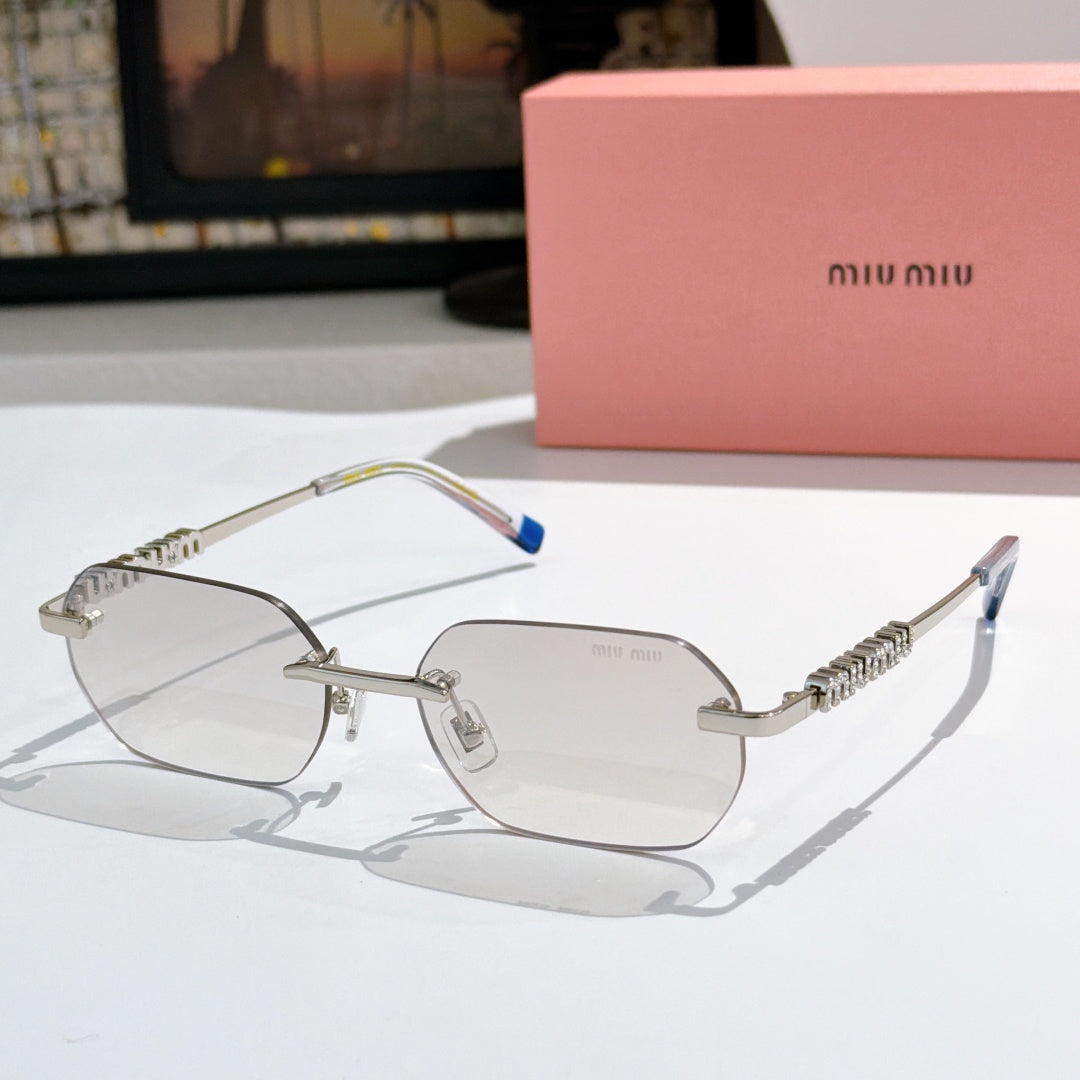 Miu Miu sunglasses with silver frame, smoky lenses, blue temple tips