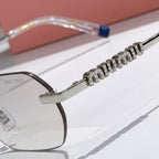 Miu Miu sunglasses frame close-up with rhinestone detail and blue temple insert