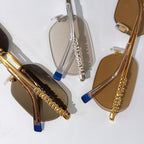 Miu Miu sunglasses assortment with gold frames, crystal details, and blue temple inserts