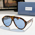 Versace sunglasses, tortoiseshell frames with pale blue lenses